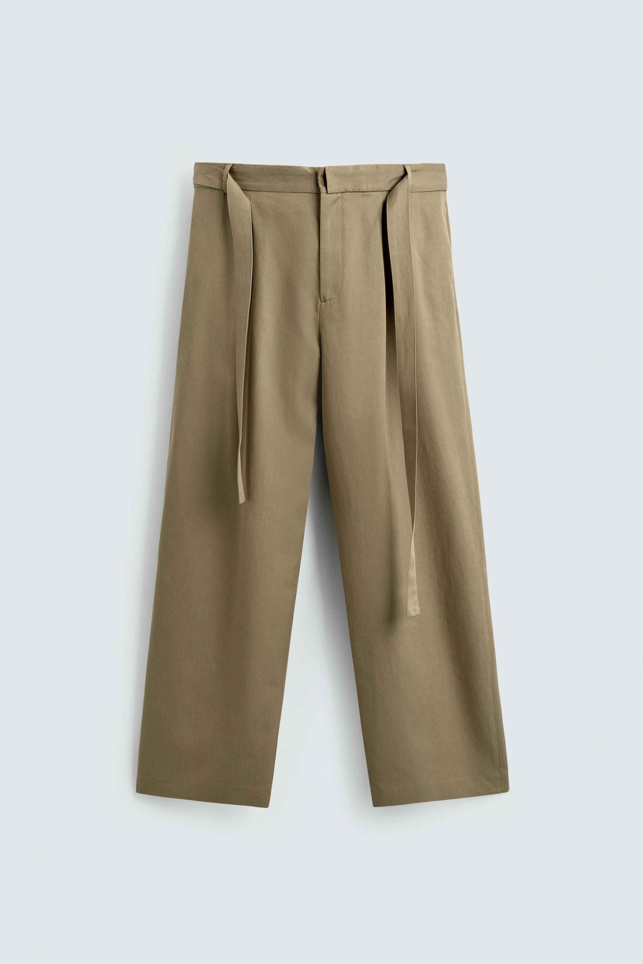 FLOWY PLEATED BELTED PANTS