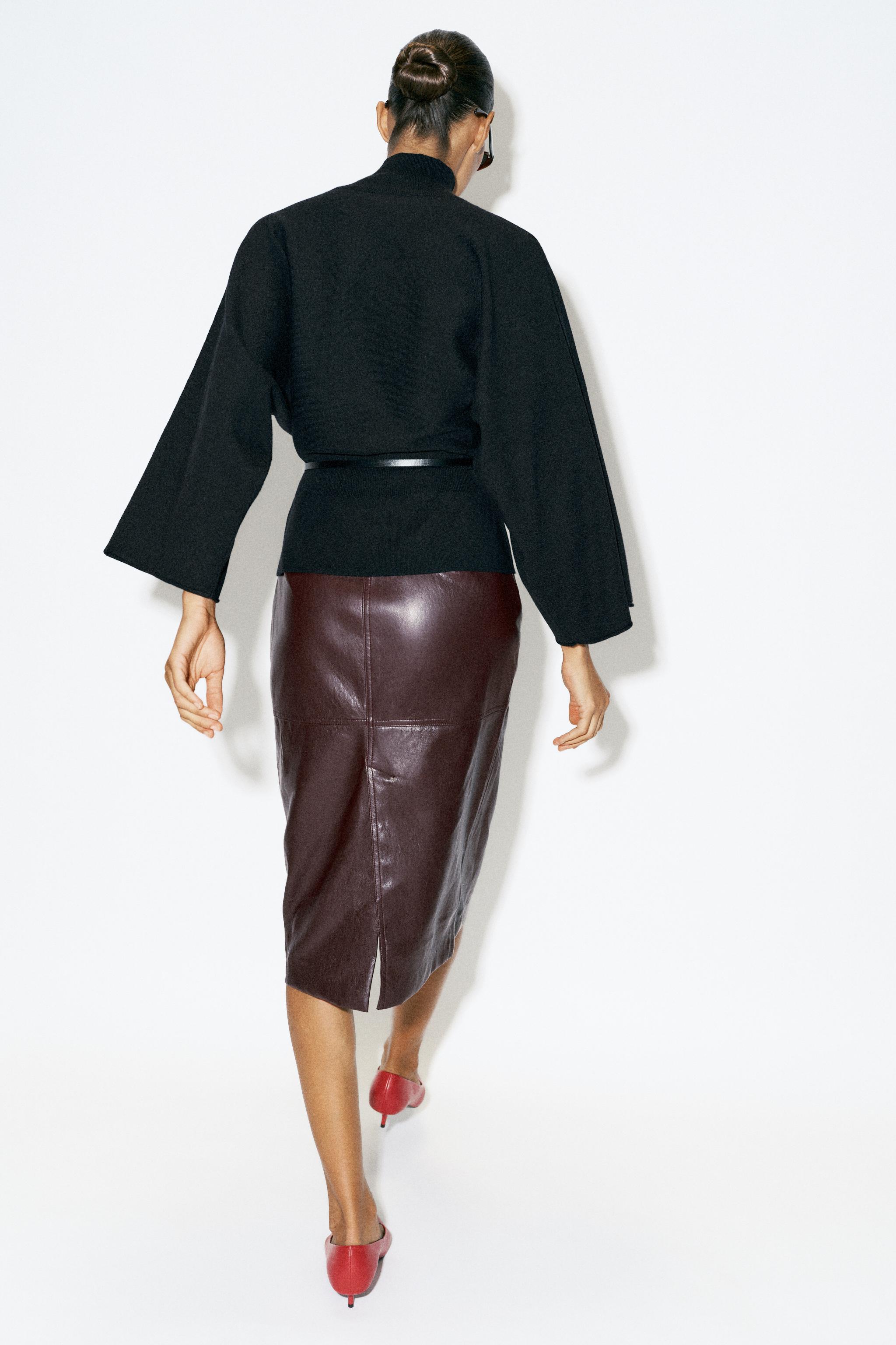 BELTED KNIT SWEATER
