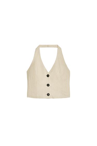 Front view of a beige waistcoat with three black buttons
