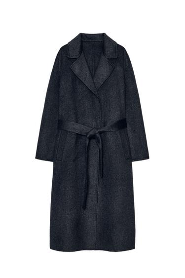 Front view of a dark grey long coat with a lapel collar, long sleeves, jetted front pockets, and a self-fabric belt.