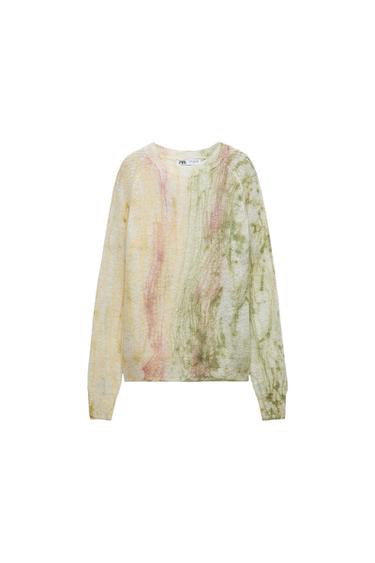 Front view of a sweater with a multicolor print in shades of green, pink, and yellow, featuring a crew neck and long sleeves.