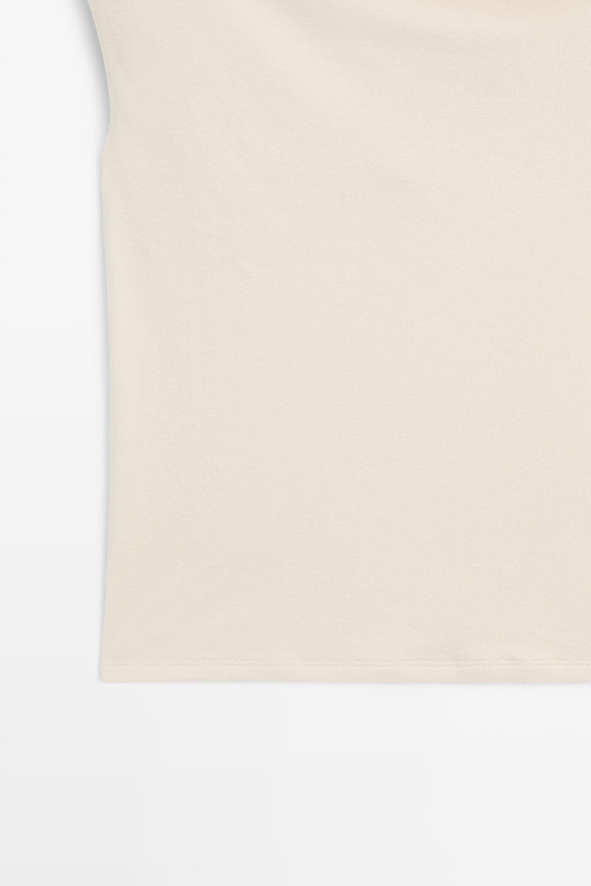 Asymmetric drop sleeve top