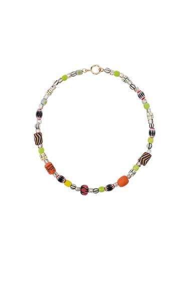 Multi-coloured necklace with resin and ceramic pieces, gold lobster clasp.