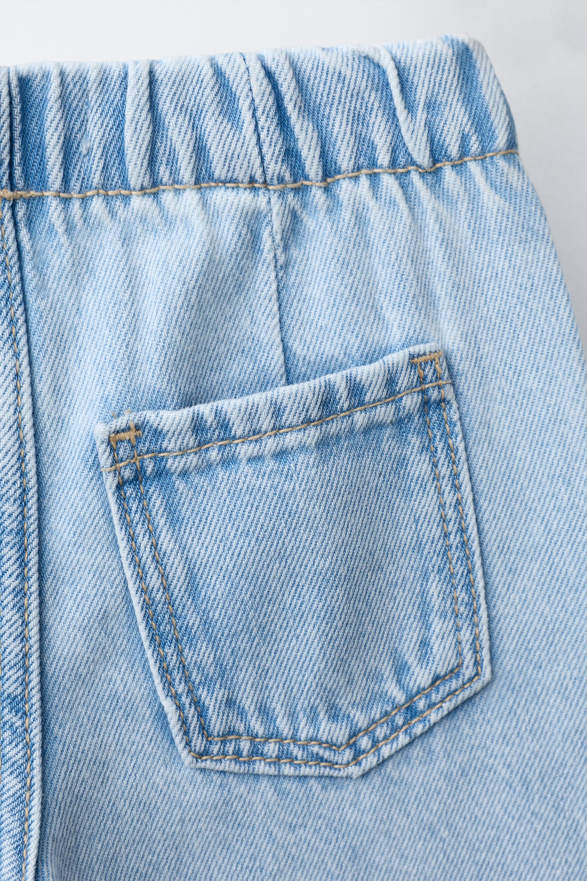 JEAN WIDE LEG À DÉCHIRURES
