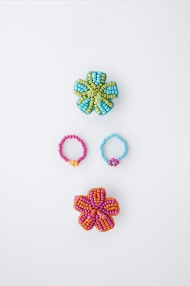 FOUR PACK OF FLOWER BEADED RINGS - Fuchsia by Zara