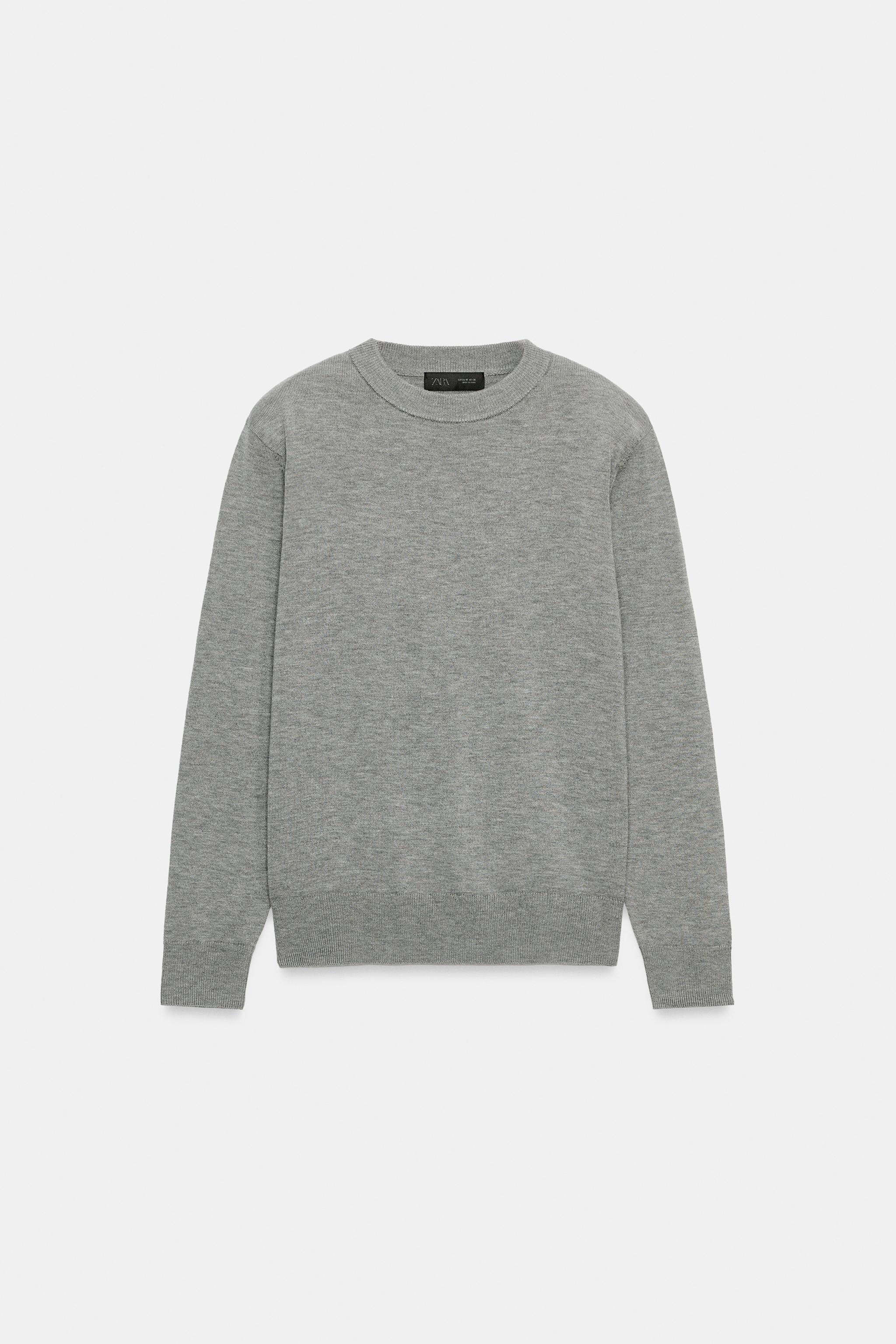 PULL EN MAILLE À ÉPAULETTES