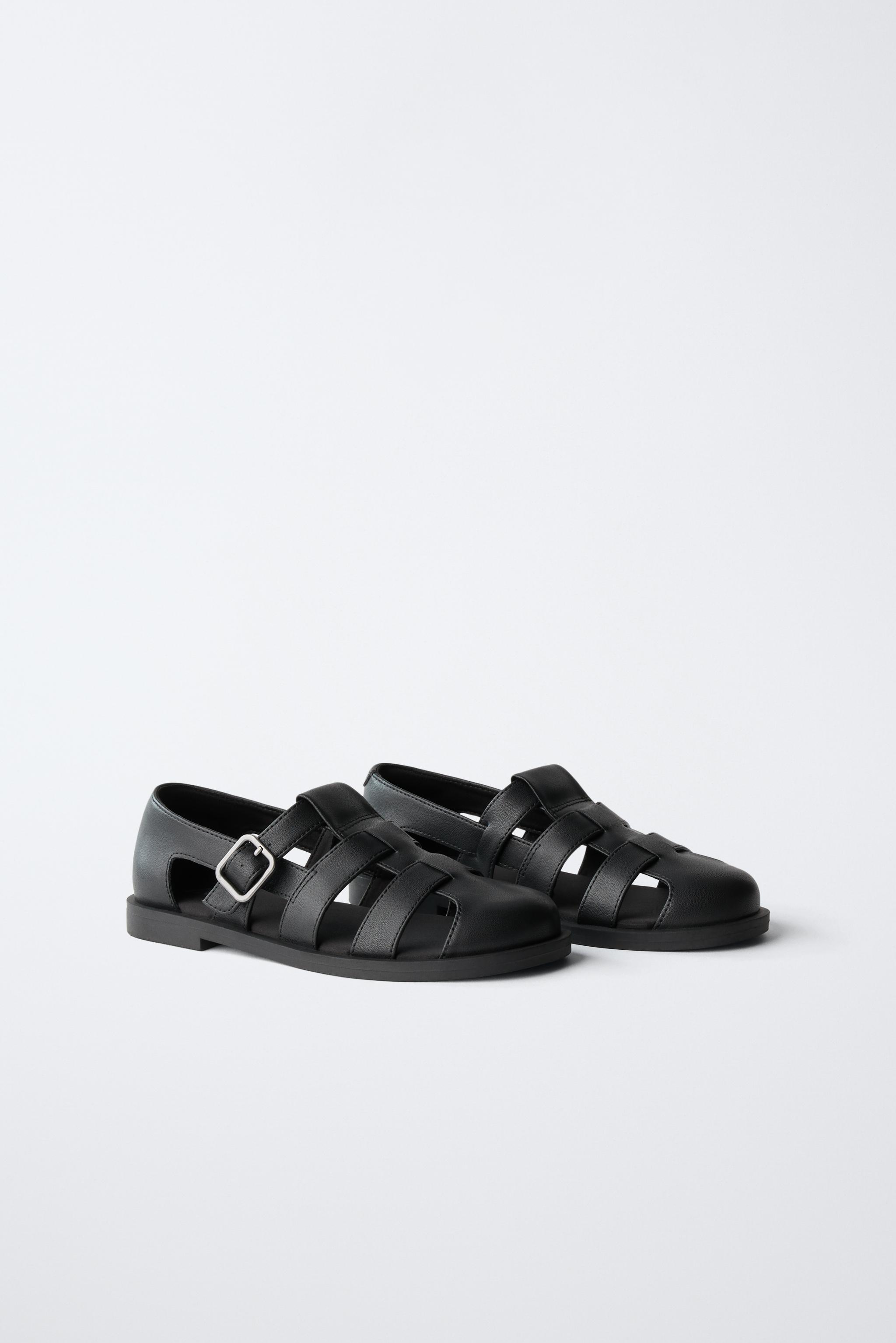 BUCKLED FISHERMAN SANDALS — Black