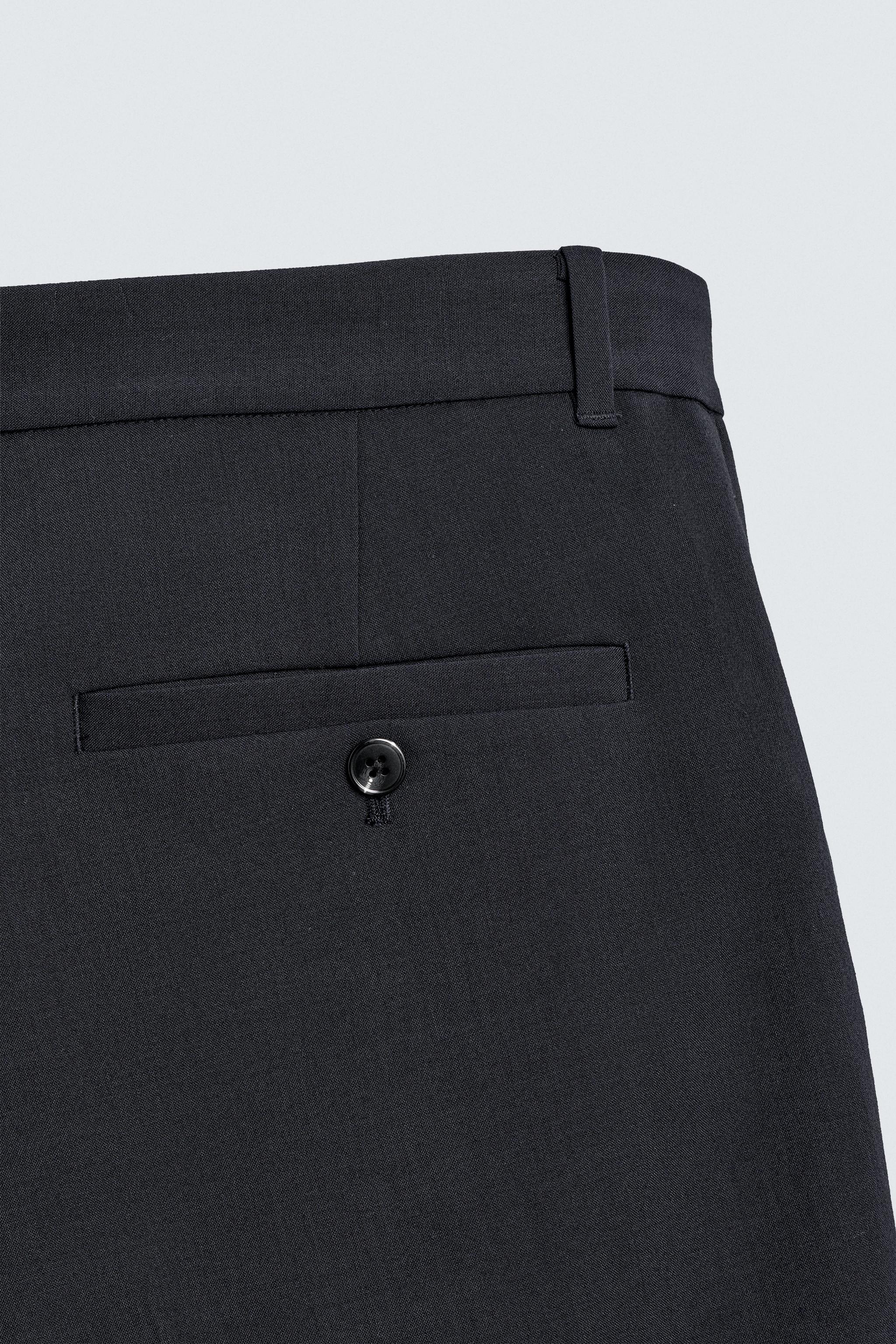 RELAXED FIT PLEATED SUIT SHORTS