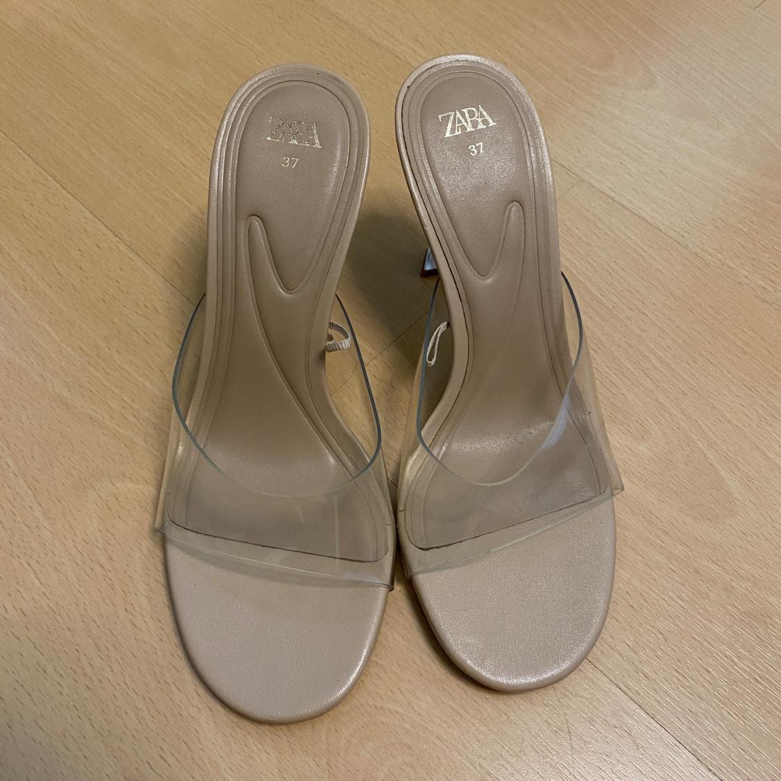 Front view of sandals with transparent heel and front strap, size 37.
