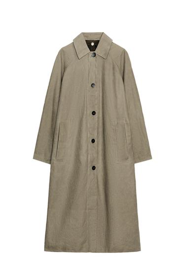 Front view of a light khaki trench coat with a shirt collar, long sleeves, front pockets and button fastening.
