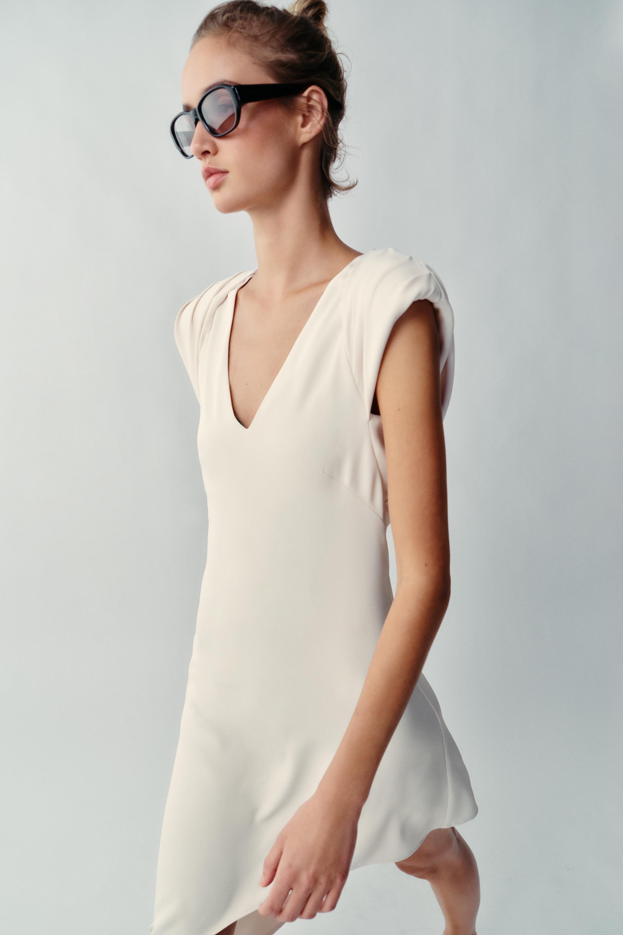ASYMMETRIC SHORT DRESS WITH SHOULDER PADS