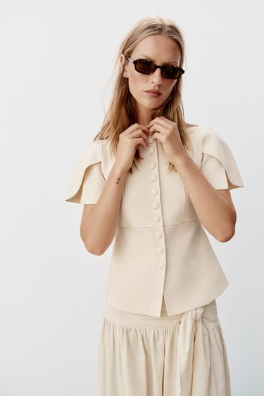 CHAQUETA PUNTO MANGA ABULLONADA ABERTURAS - Crudo de Zara