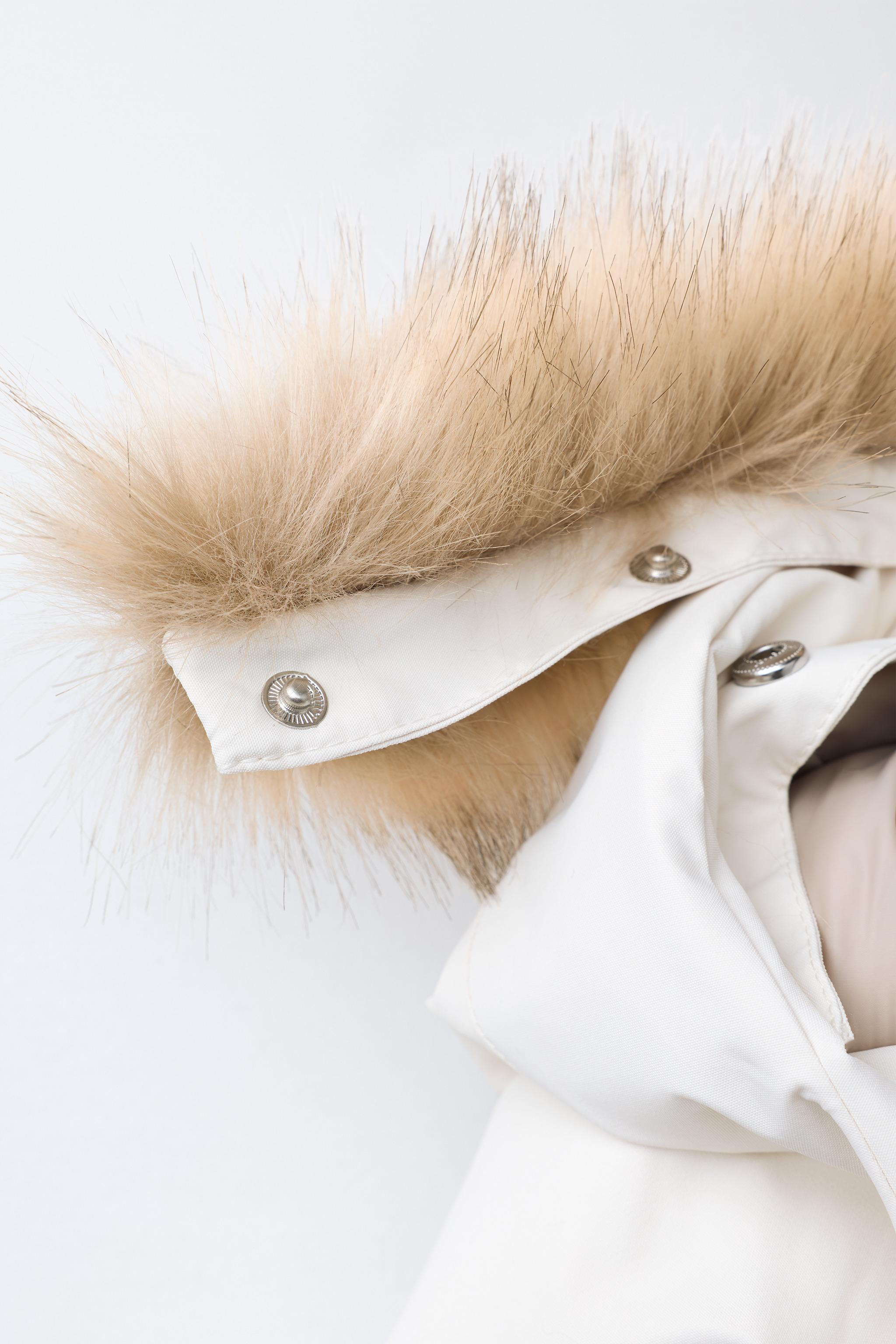 WATER RESISTANT AND WINDPROOF RECCO® SYSTEM SKI COLLECTION LONG JUMPSUIT WITH FAUX FUR HOODIE