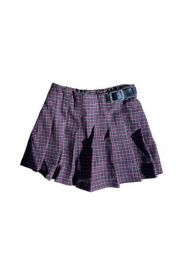 Pleated short plaid skirt in red and gray tones, includes a black belt with a silver buckle at the waist.