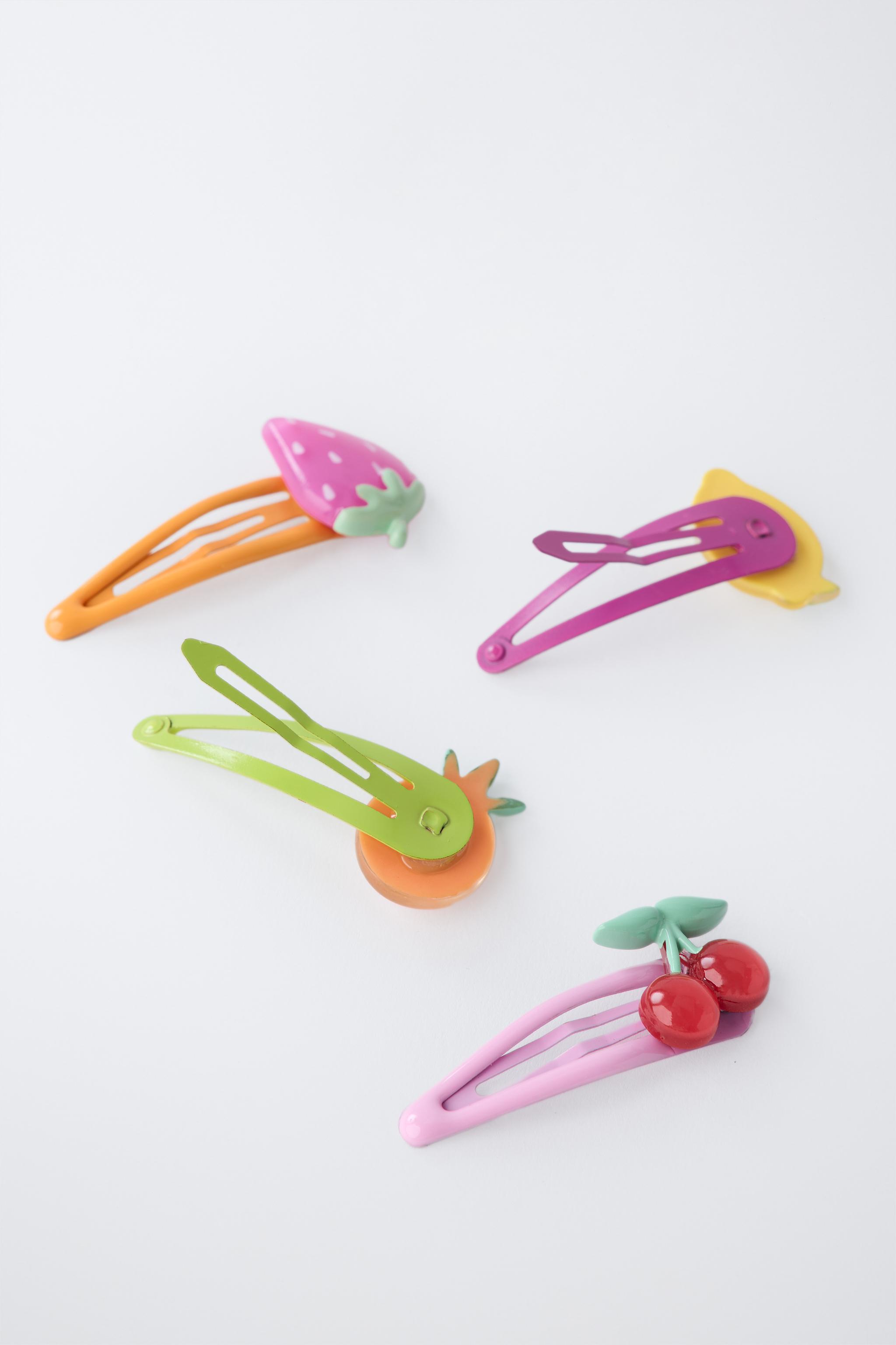 LOT DE QUATRE PINCES FRUITS