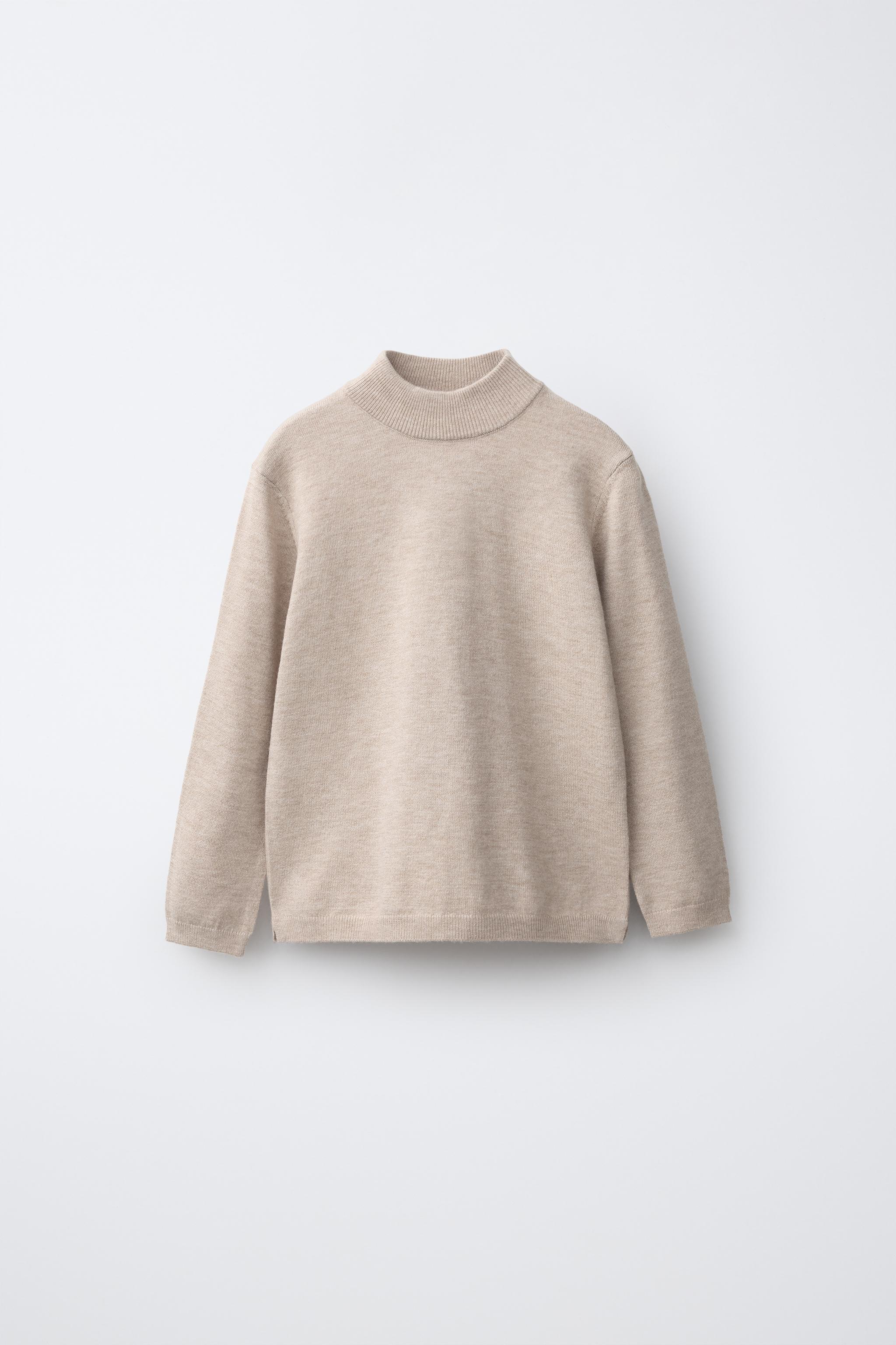 PULL EN MAILLE À COL CHEMINÉE