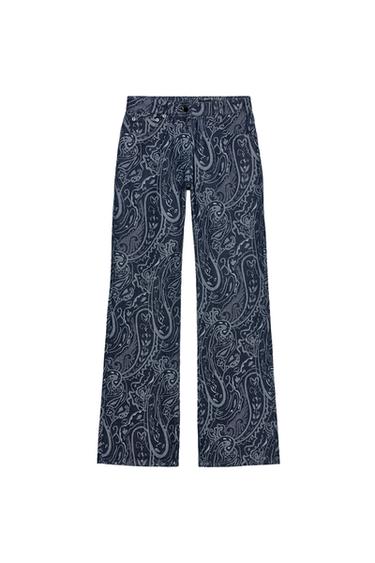 Front view of blue denim trousers with a jacquard print, mid-rise, five pockets, and front zip and button fastening.
