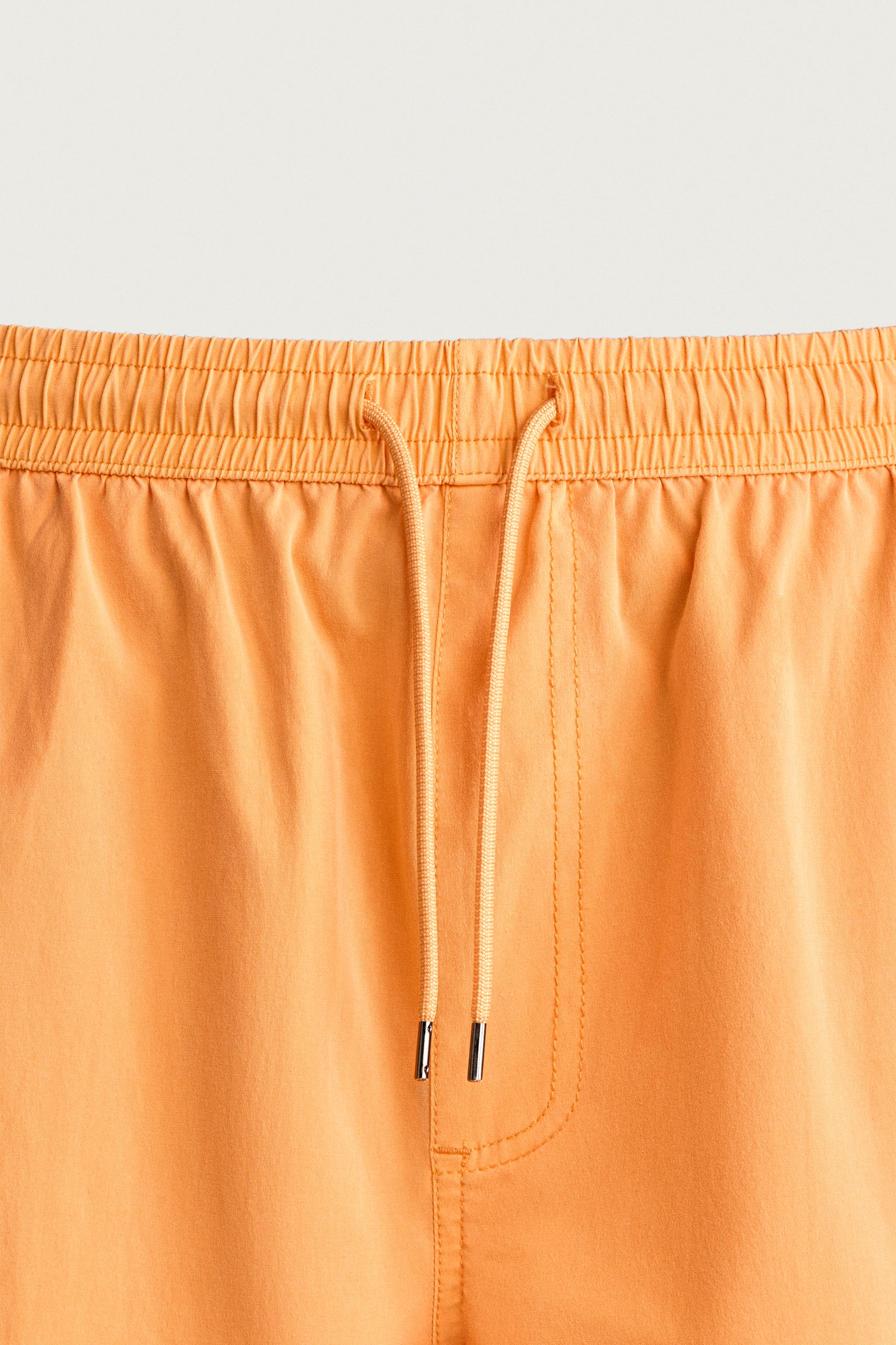 WASHED EFFECT LONG SWIM TRUNKS