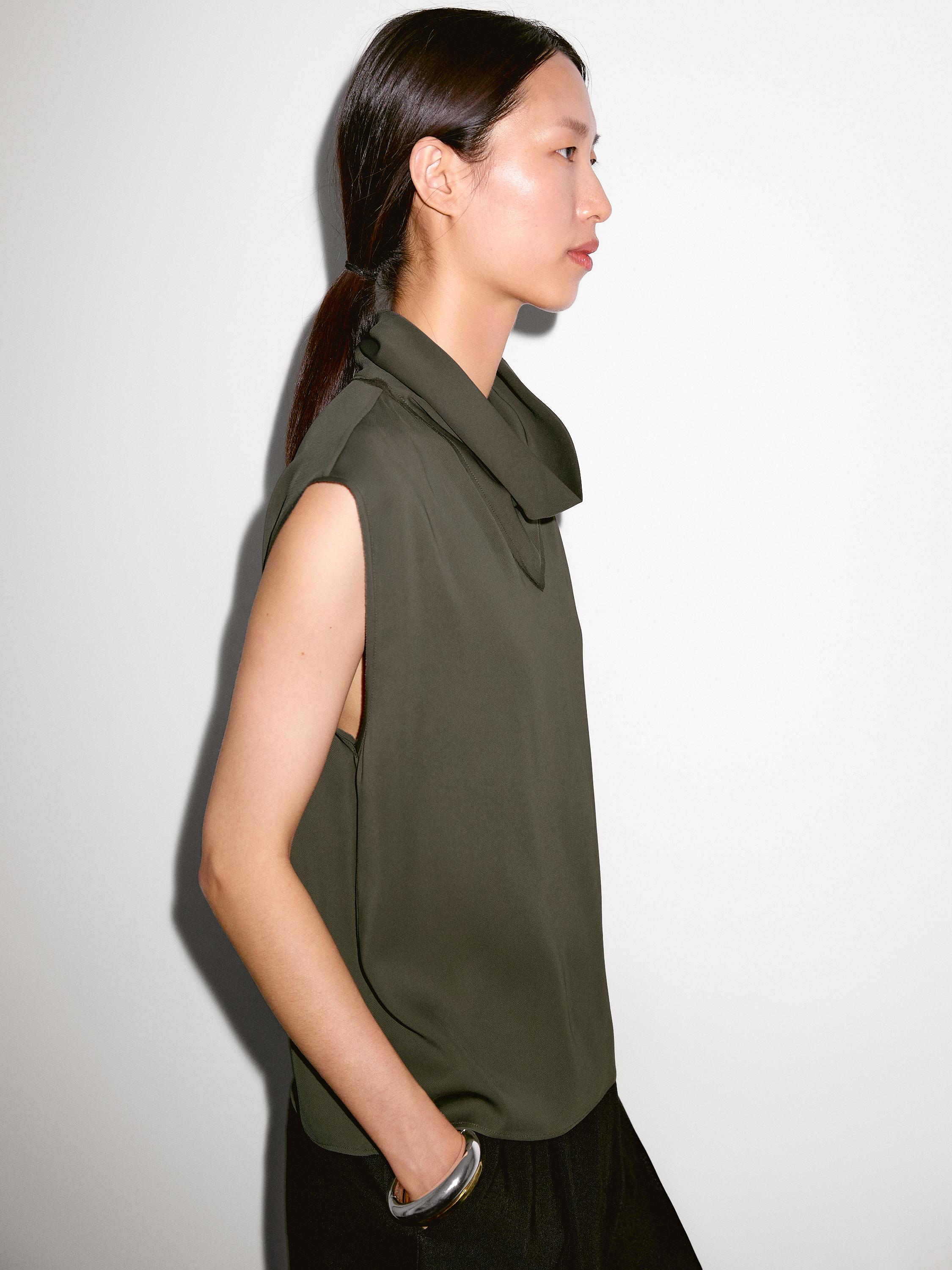 Flowing blouse with draped neck detail