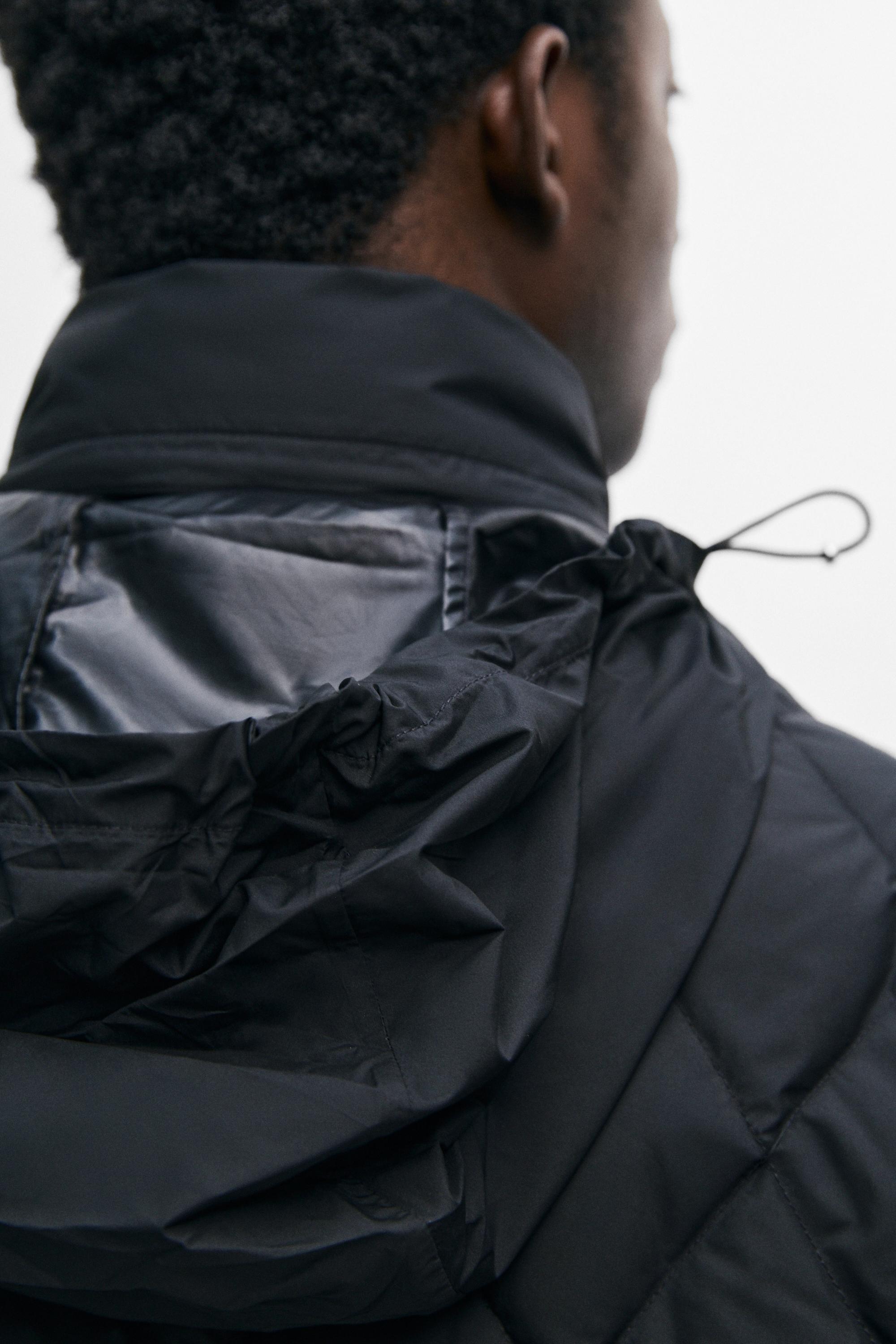 Down jacket with button detail