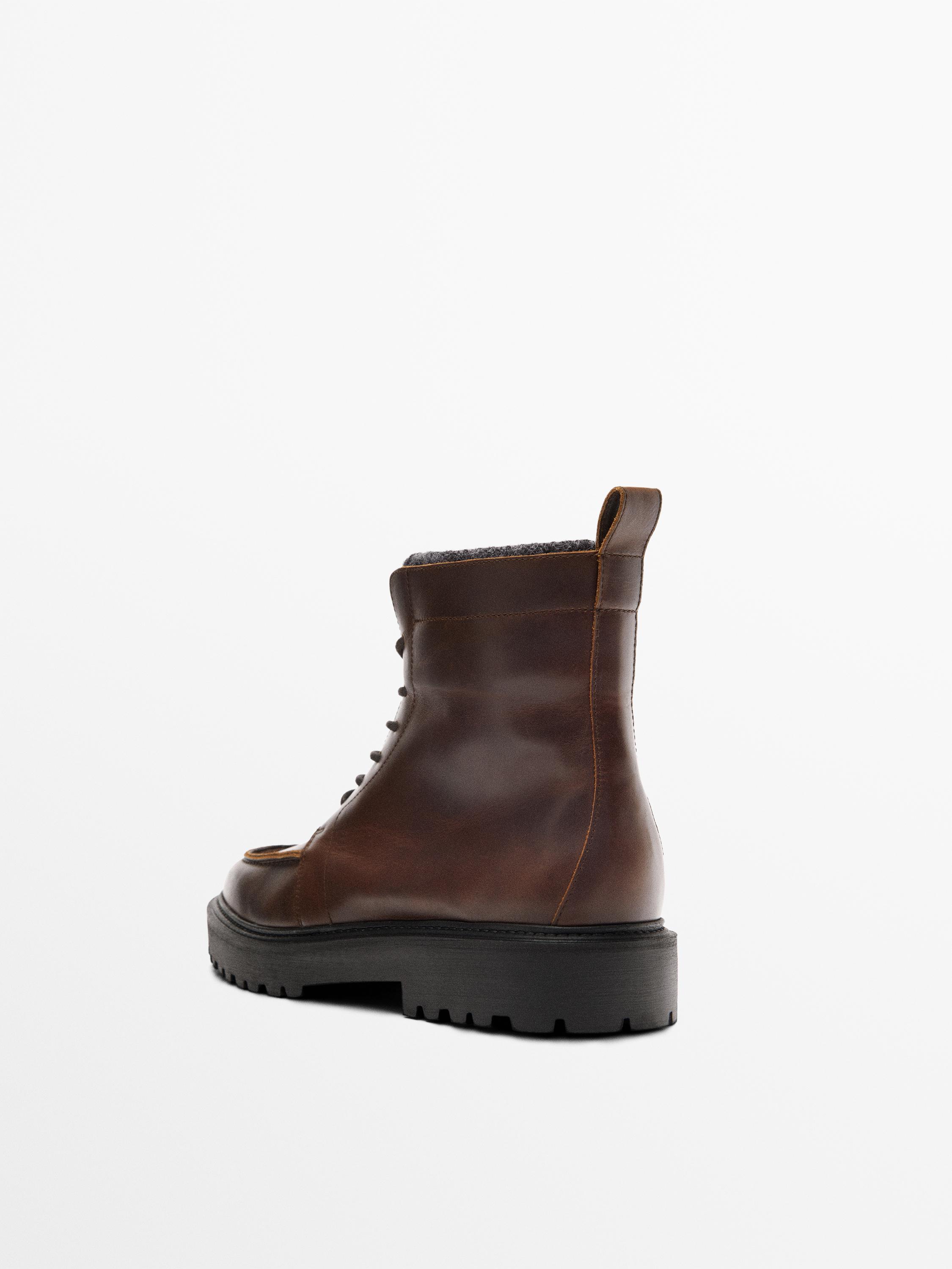 Lace-up leather boots with lined interior