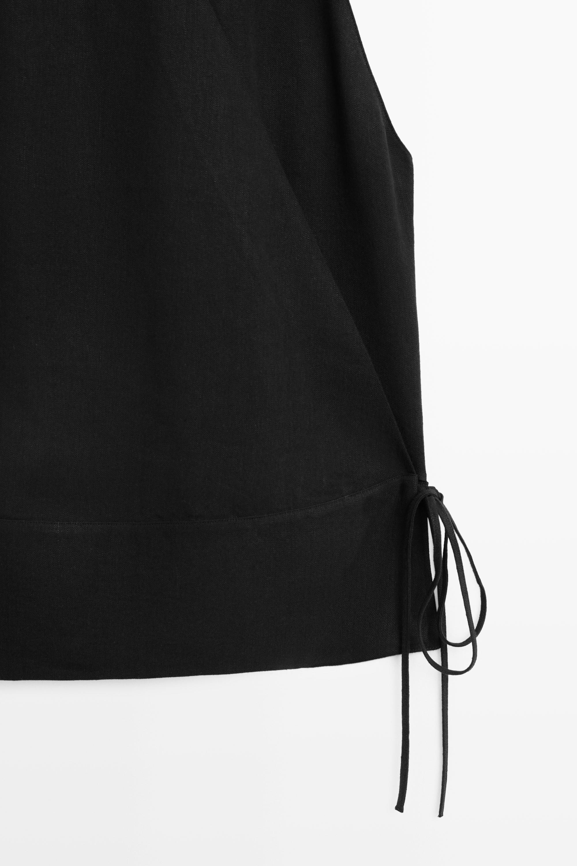 Top drapé croisé avec détail de ceinture