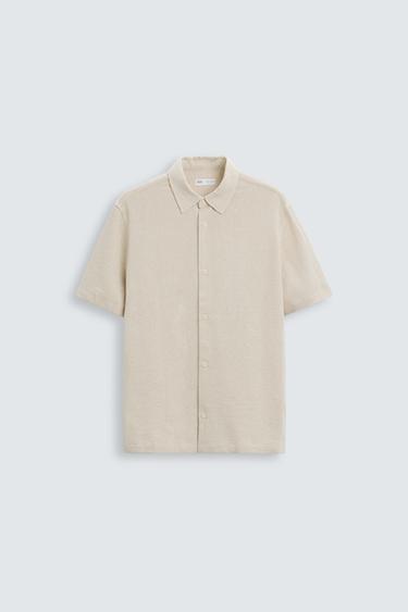 Zara Relaxed fit shirt made of cotton blend fabric. Lapel collar and short sleeves. Side vents at hem. Front button closure. - Light beige