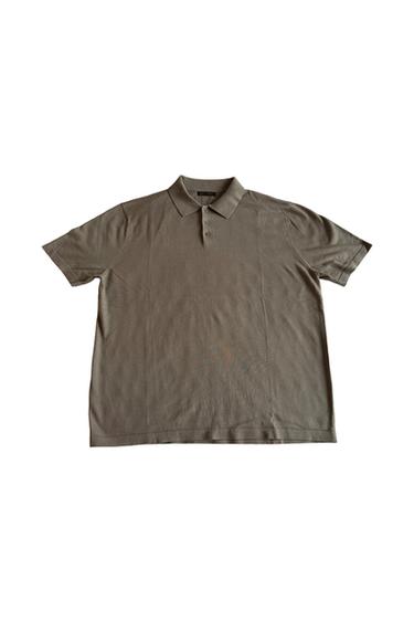 Short-sleeve khaki polo shirt with a classic collar and three buttons, displayed flat against a white background.