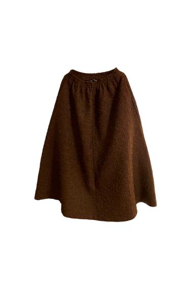 Brown skirt with a rough texture, with an elasticated waist, on a white background.