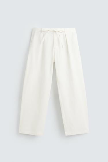 PANTALON COUPE DÉCONTRACTÉE PLIS - Écru de Zara