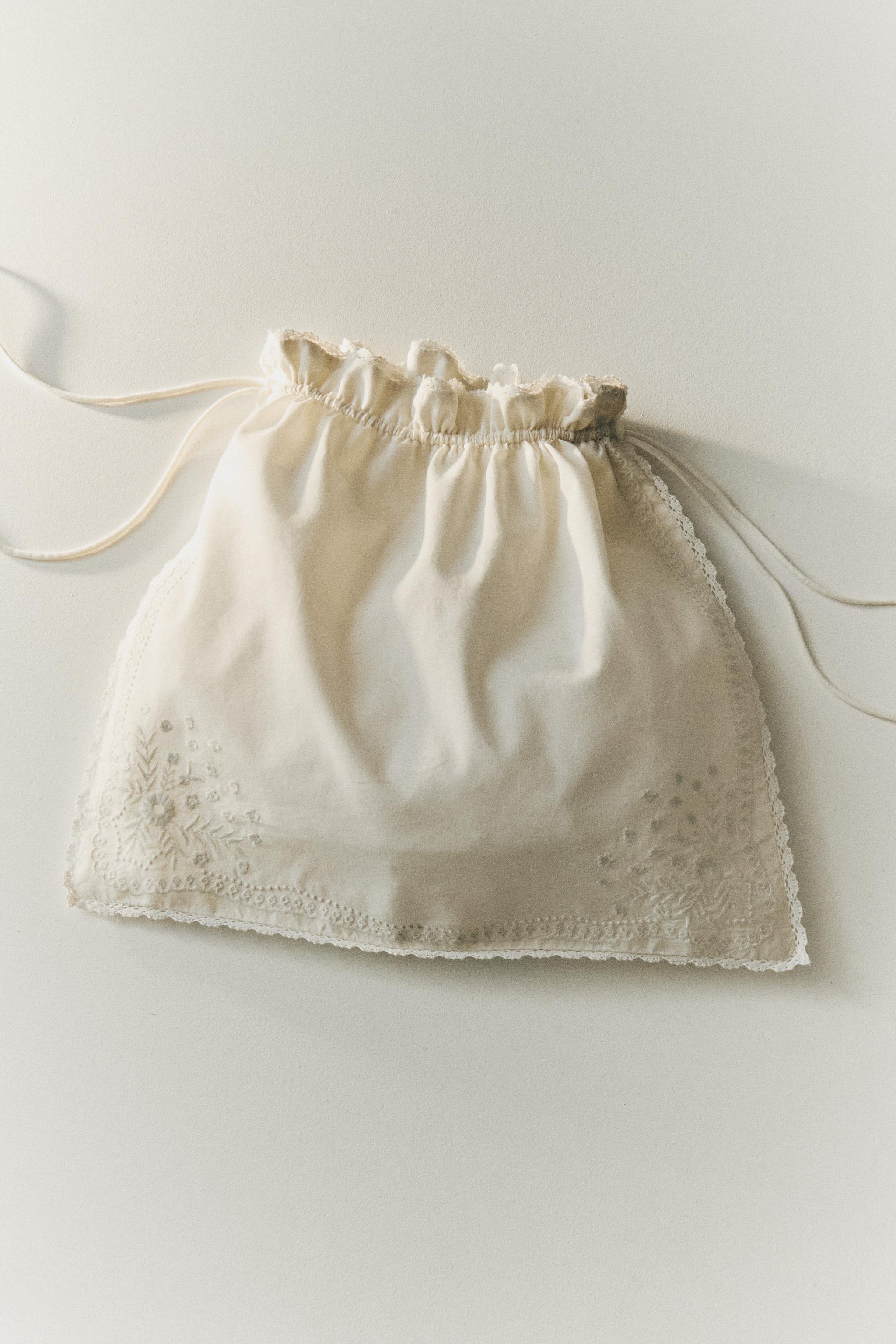 EMBROIDERED LACE TRIM COTTON CLOTHING BAG — Ivory
