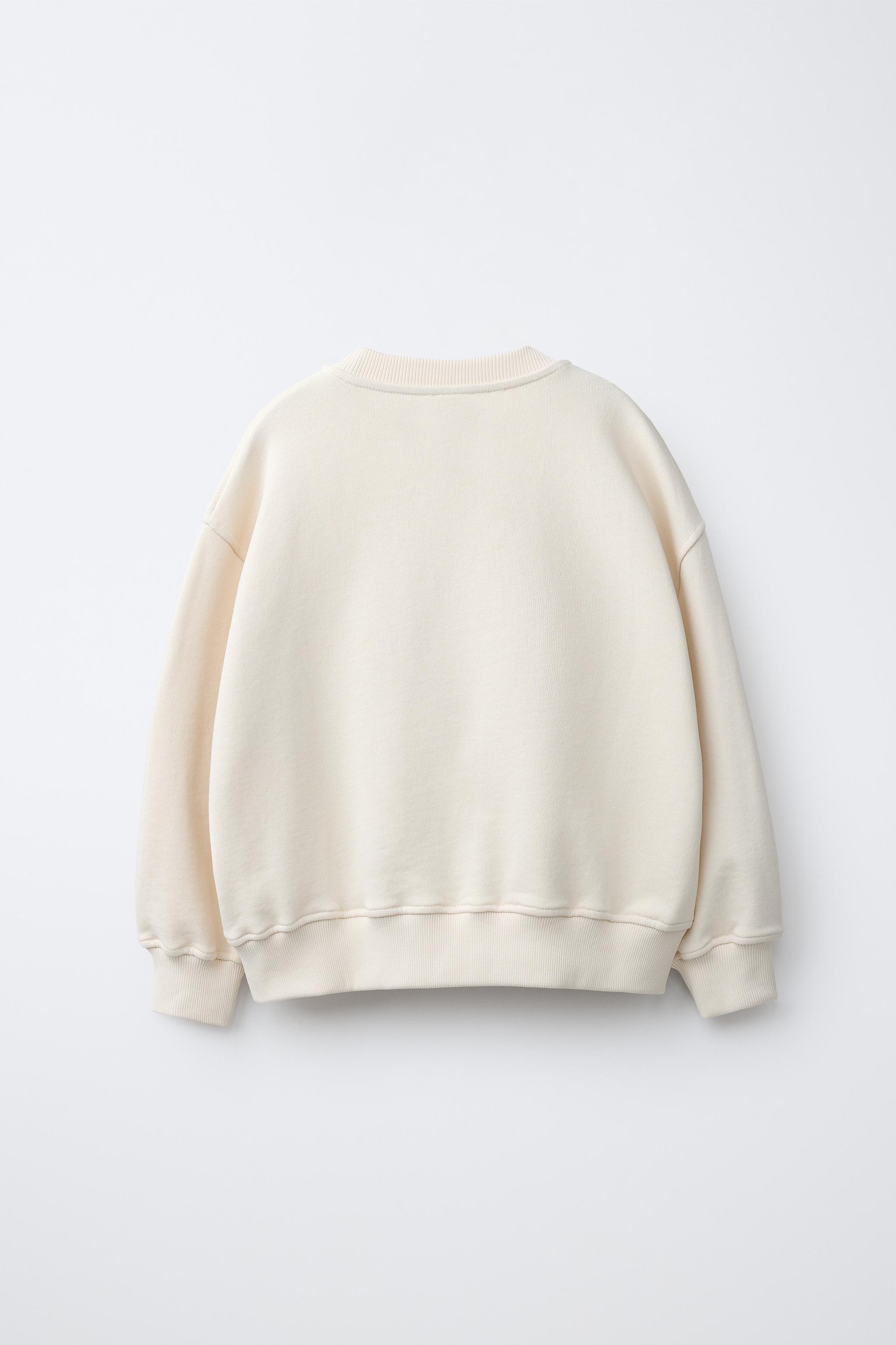 EMBROIDERED INSET SWEATSHIRT