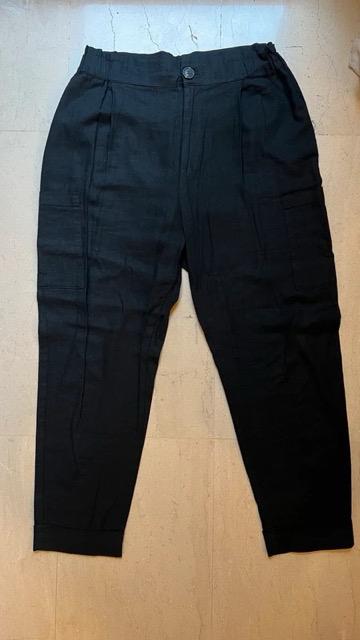 Lightweight black trousers with pleats, front button and zip fastening, on a light background.