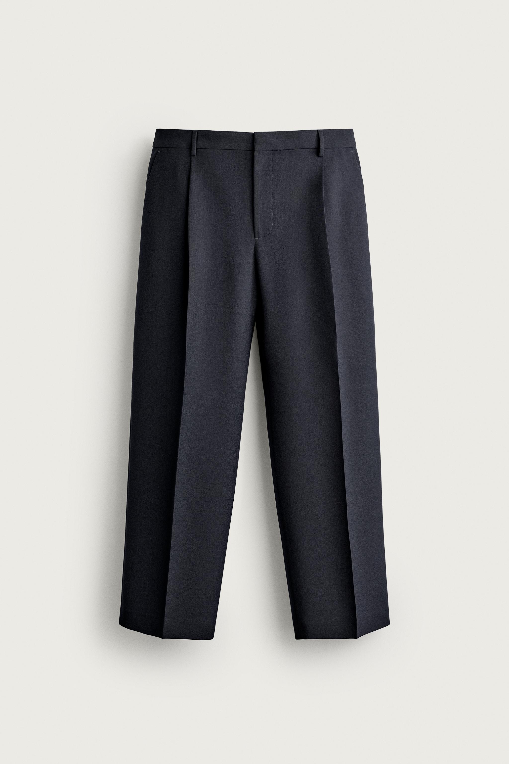 RELAXED FIT PLEATED PANTS — Navy blue
