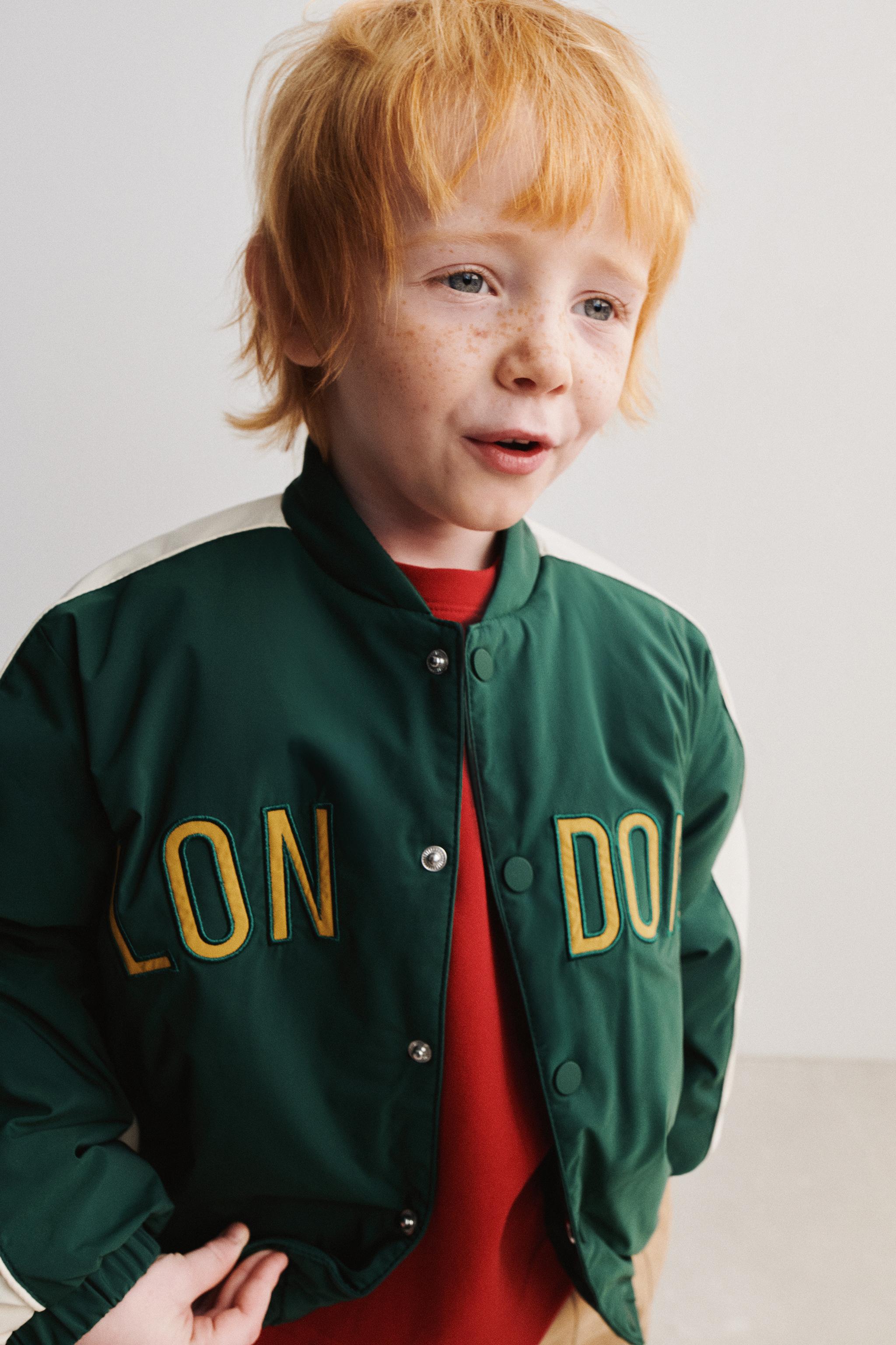 BLOUSON BOMBER CAPUCHE EN MOLLETON AMOVIBLE DÉPERLANT