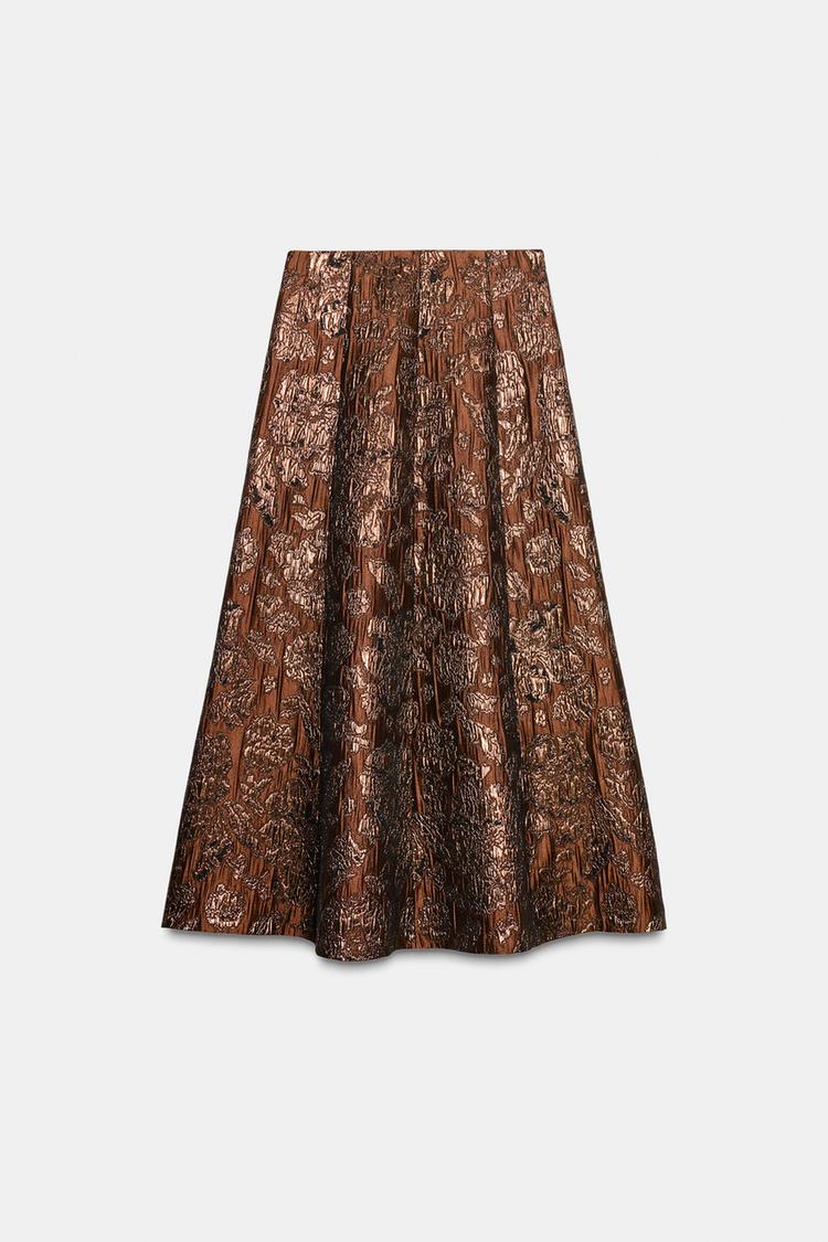 Front view of an ochre skirt with shimmer, A-line cut and side zip fastening.