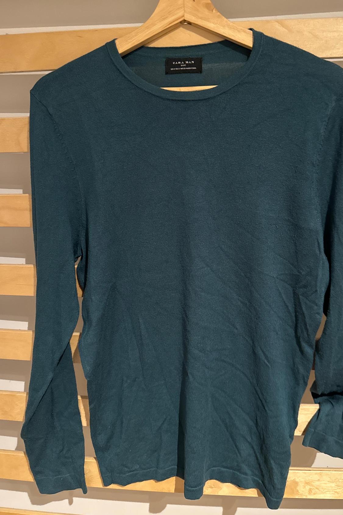 Front view of blue long-sleeved round-neck t-shirt.