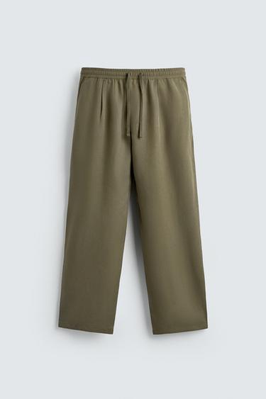 PANTALÓN FLUIDO RELAXED FIT - Oliva de Zara