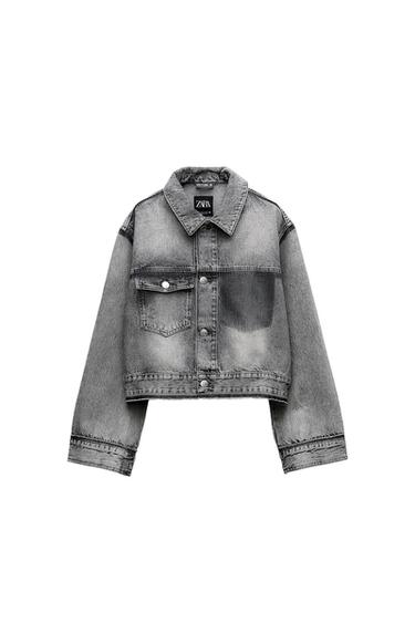 Faded gray denim crop jacket featuring front pockets and metal buttons. Visible label with "ZARA" text.