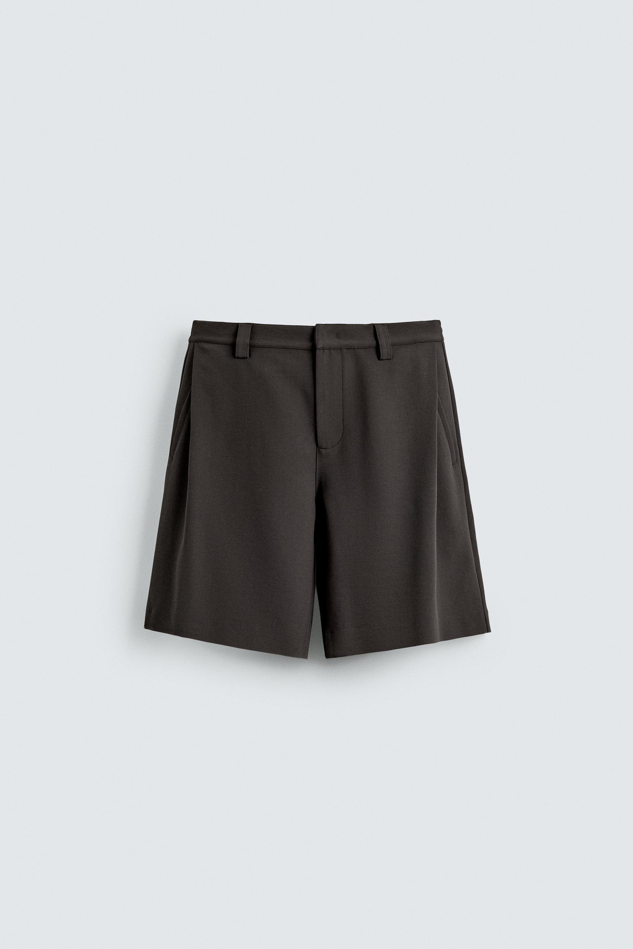 BERMUDA RELAXED FIT PLIS LATÉRAUX