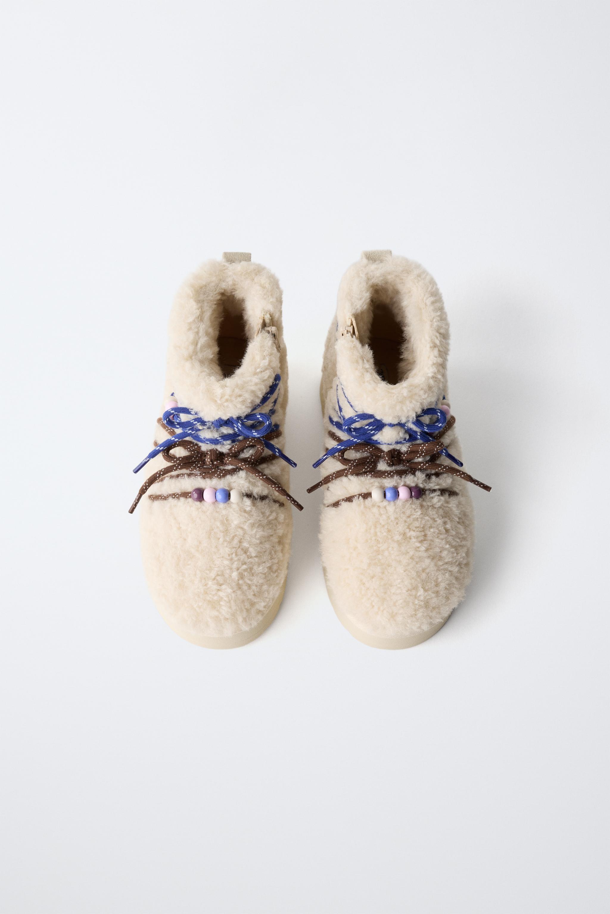 BOTTINES EN PEAU DE MOUTON CHARMS