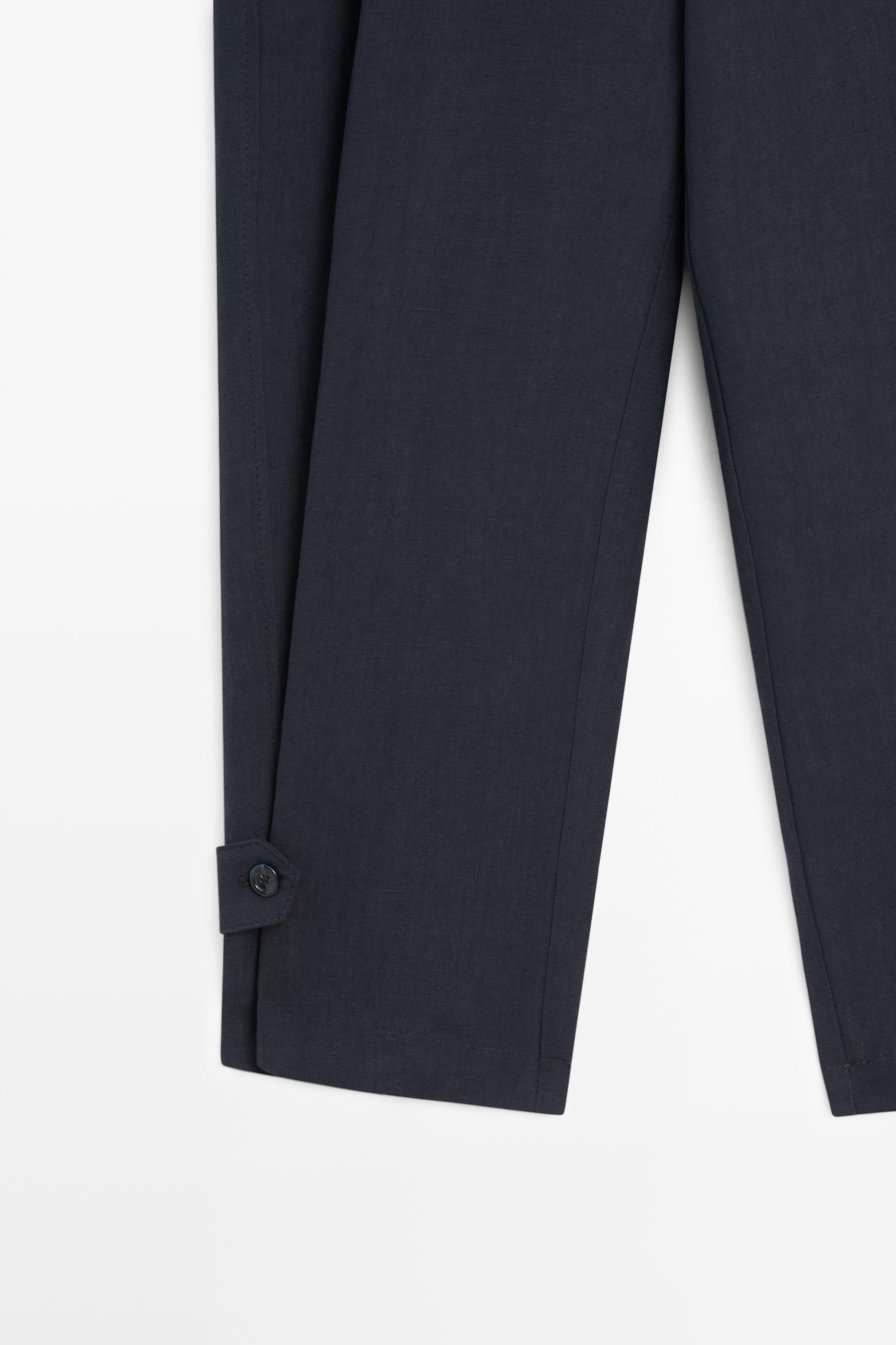 Flowing linen blend pants with buttoned tab detail