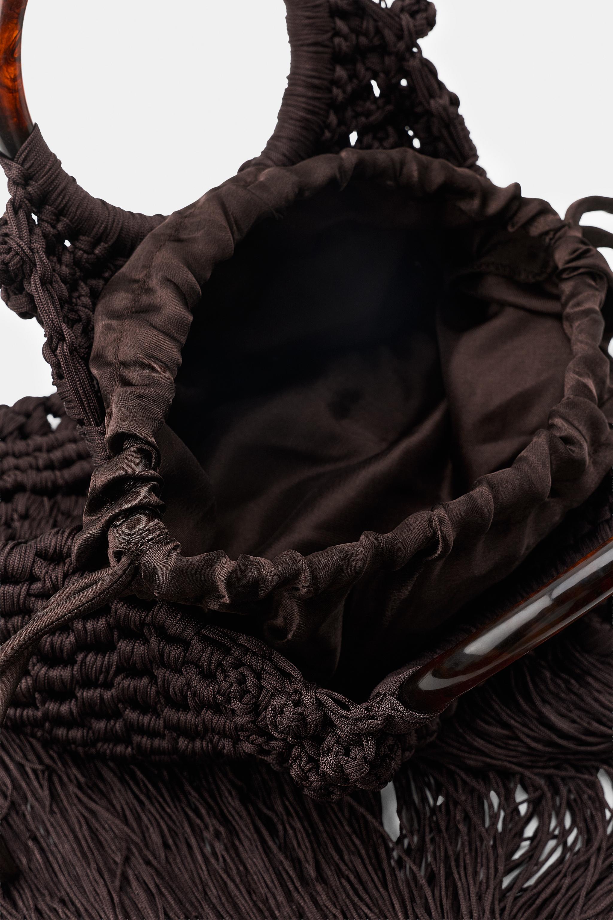 SAC EN TISSU À NŒUDS ET FRANGES