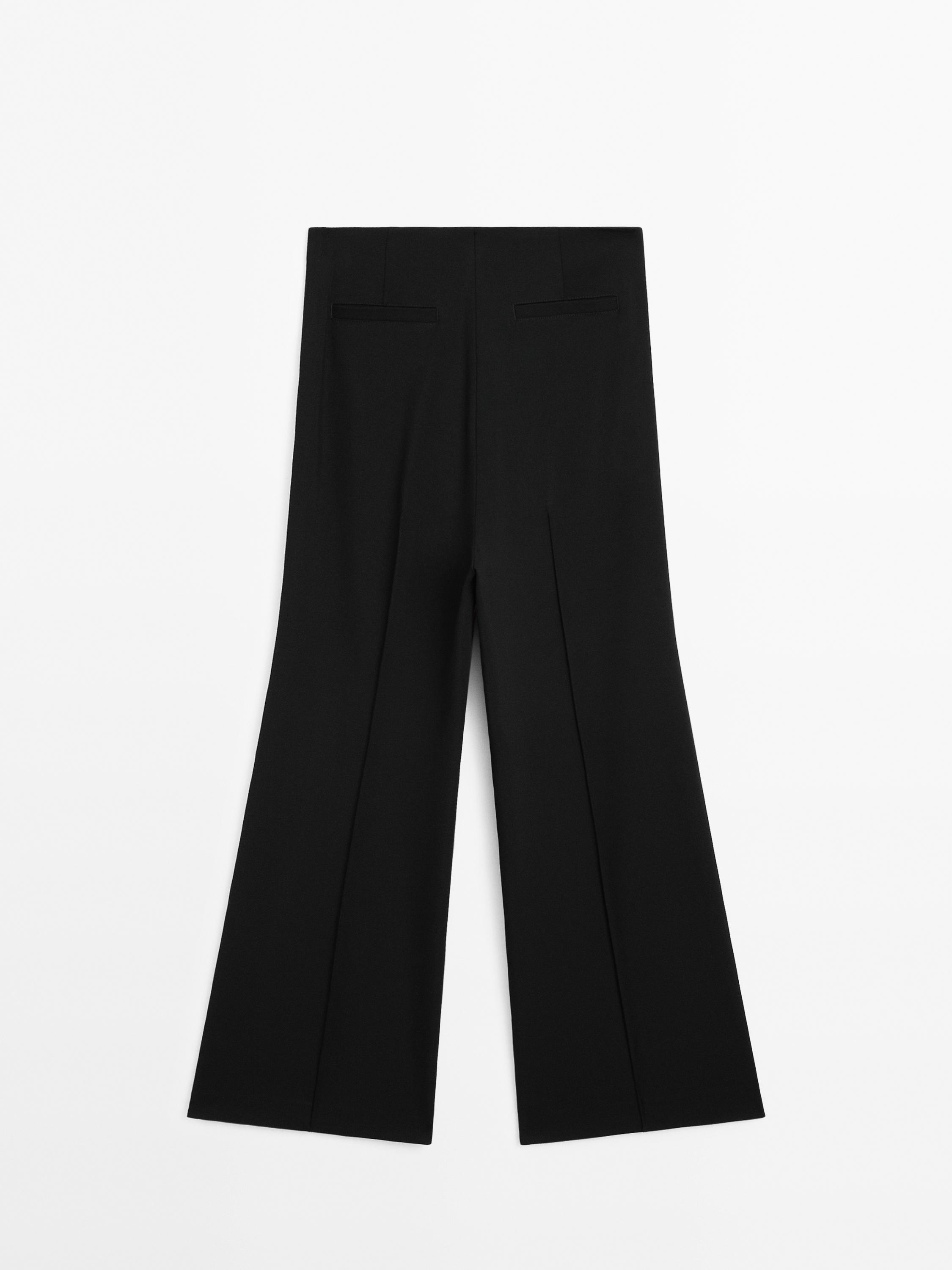 Flared trousers with zip