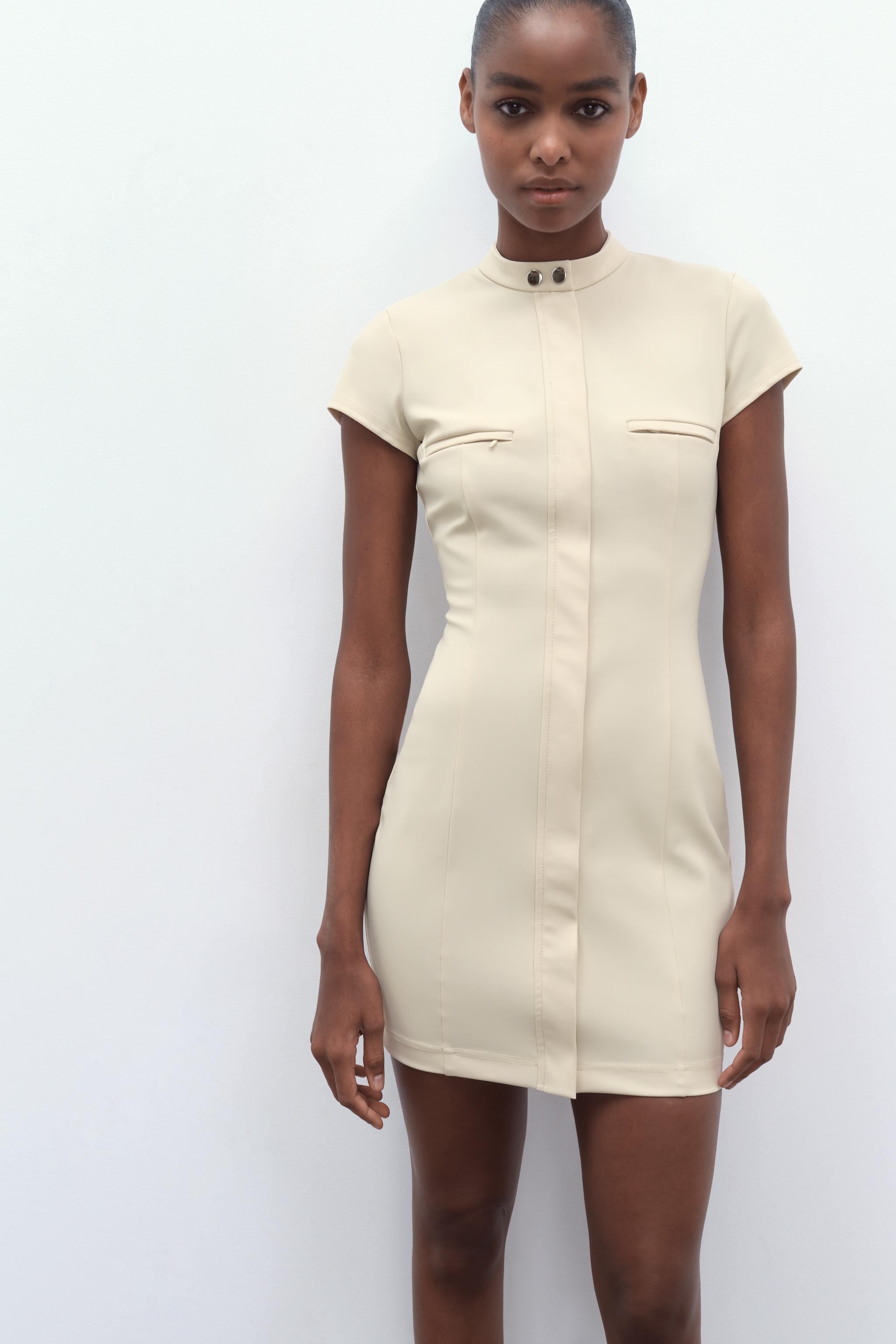 Long Sleeve Cross Over Strap Mini Dress in Cream