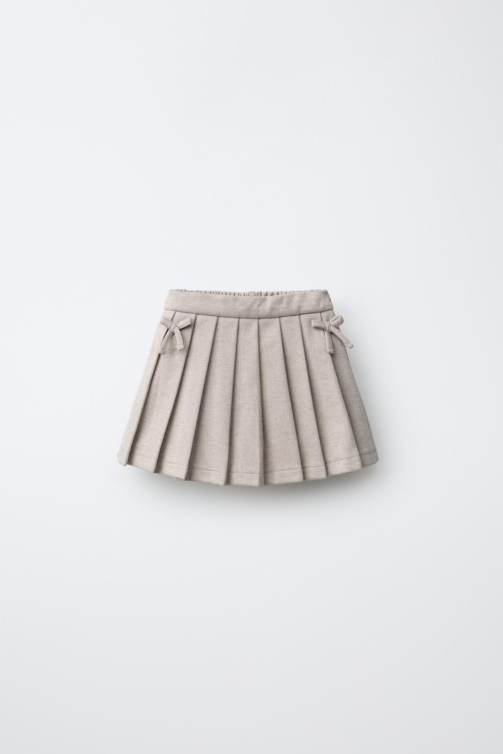 PLEATED STRUCTURED BERMUDA SKORT WITH BOWS