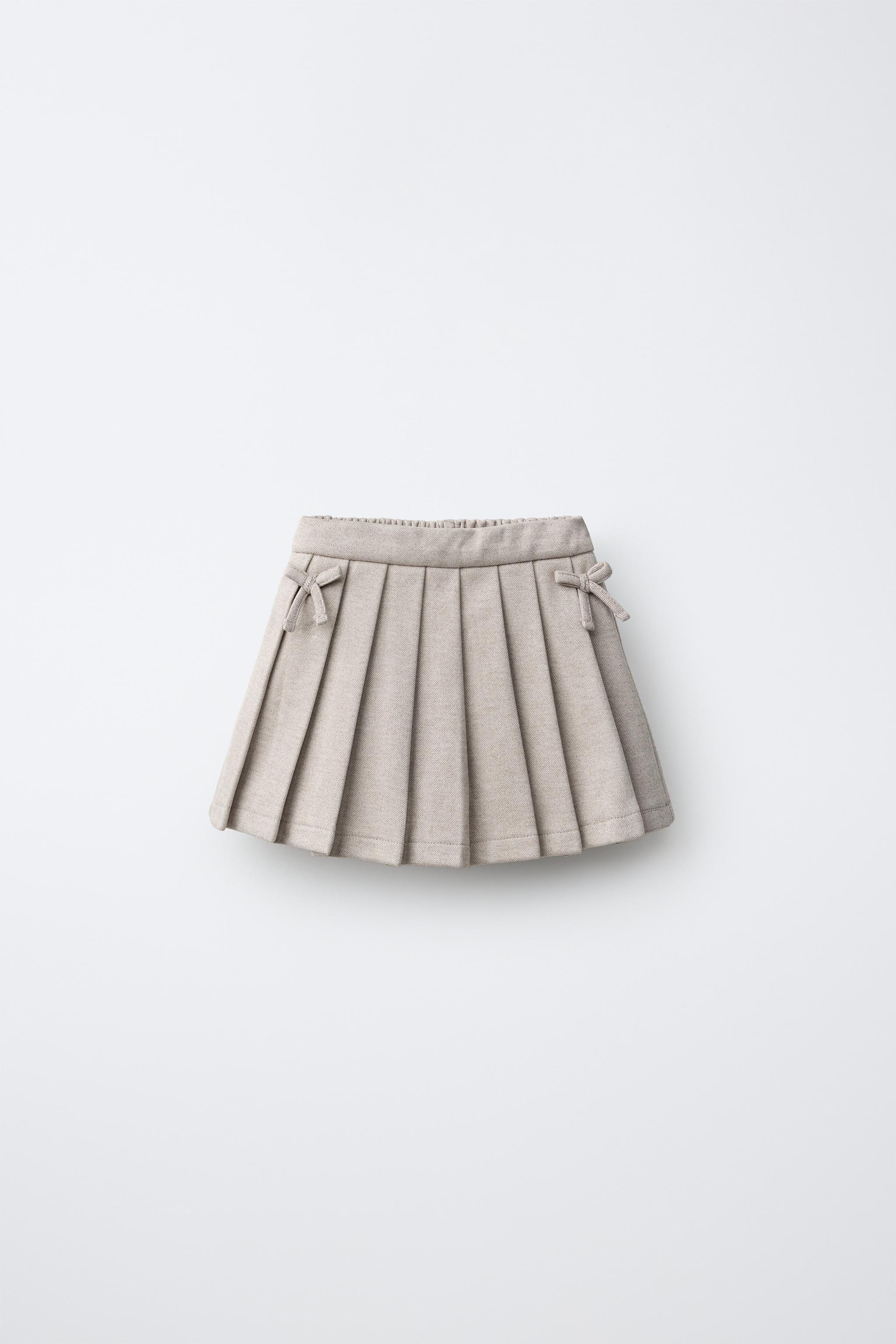 SHORT STRUCTURE JUPE PLIS PLATS LACETS