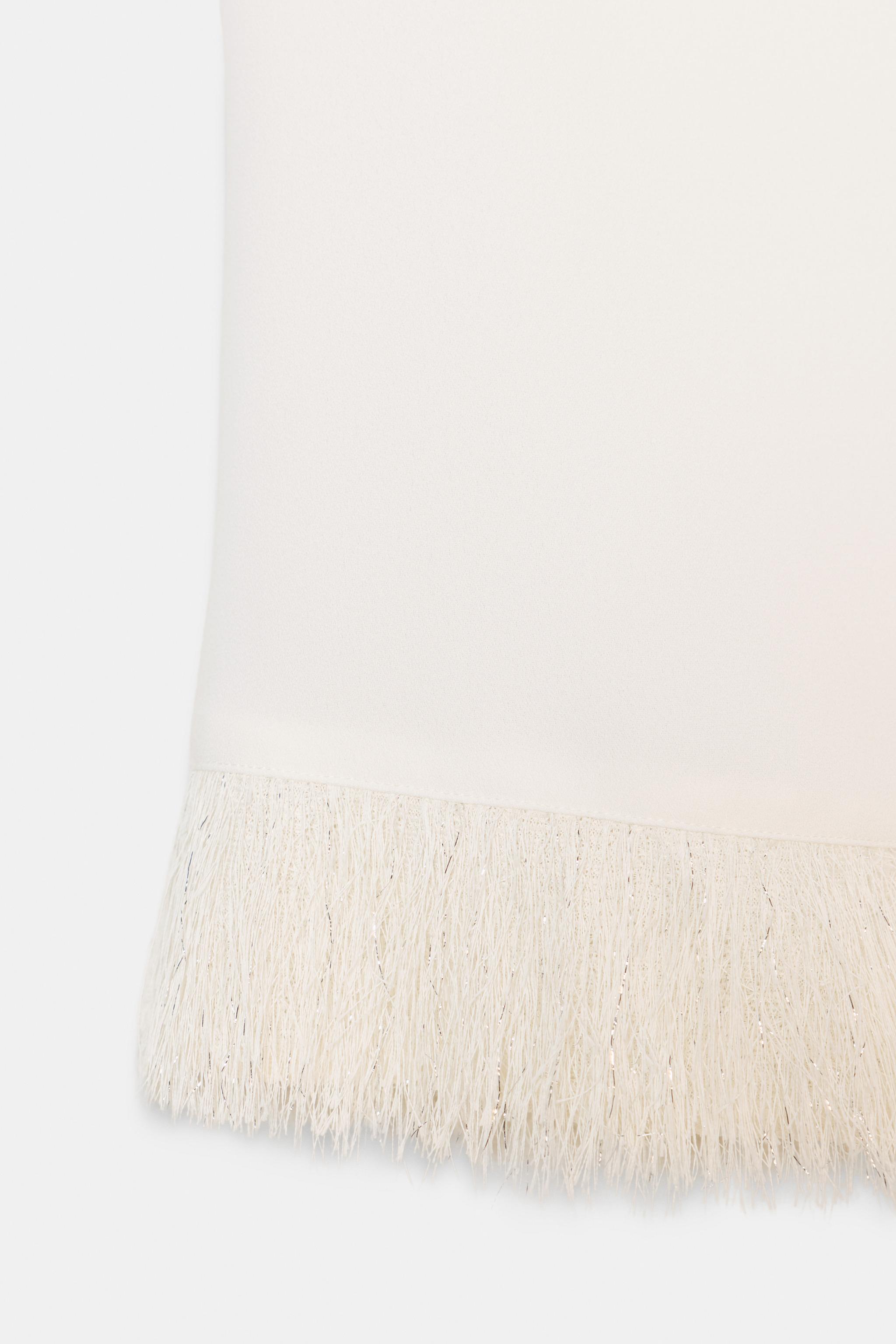 SHOULDER PAD FRINGED TOP