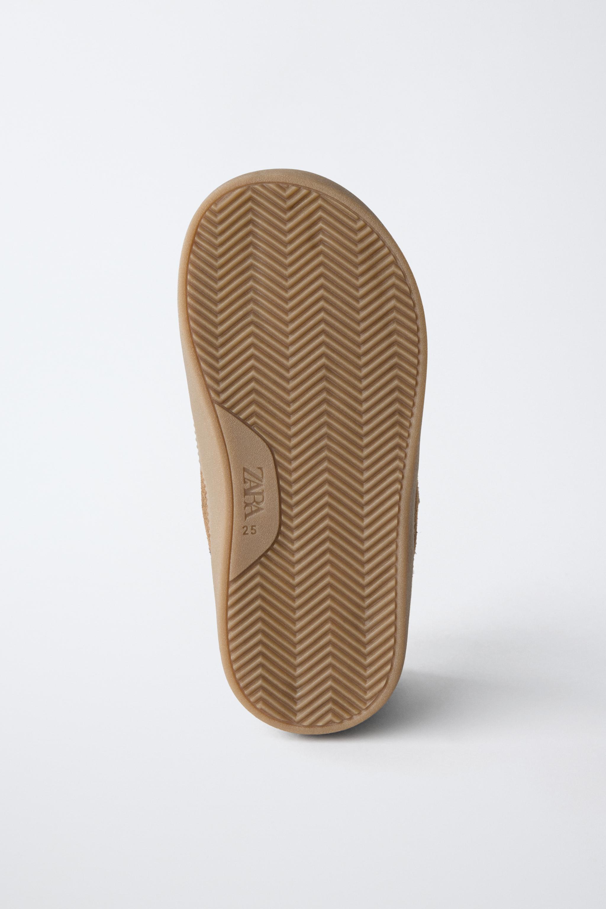 BASKETS MONTANTES EN CUIR