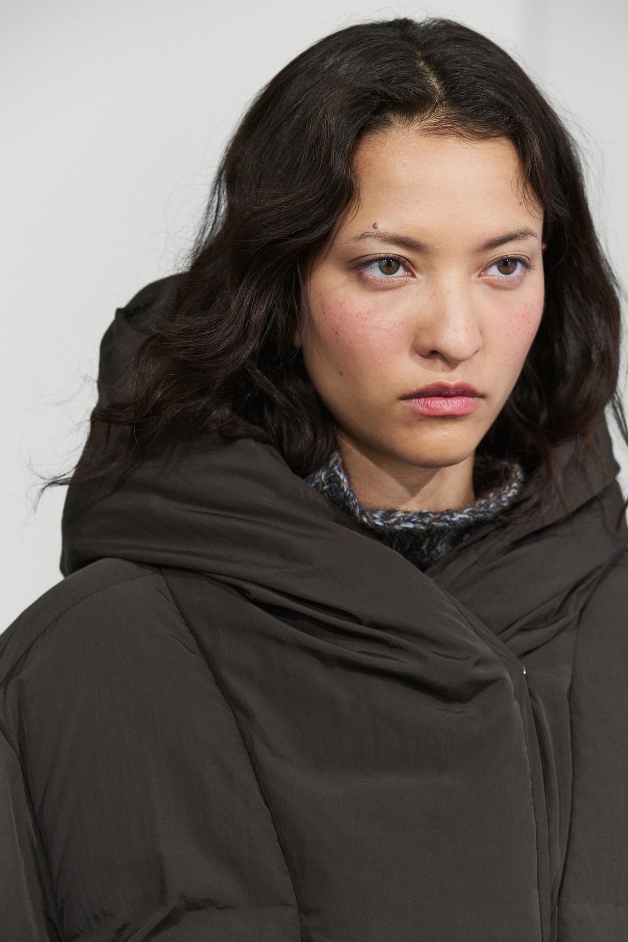 Suede puffer jacket with hood detail — Black gold